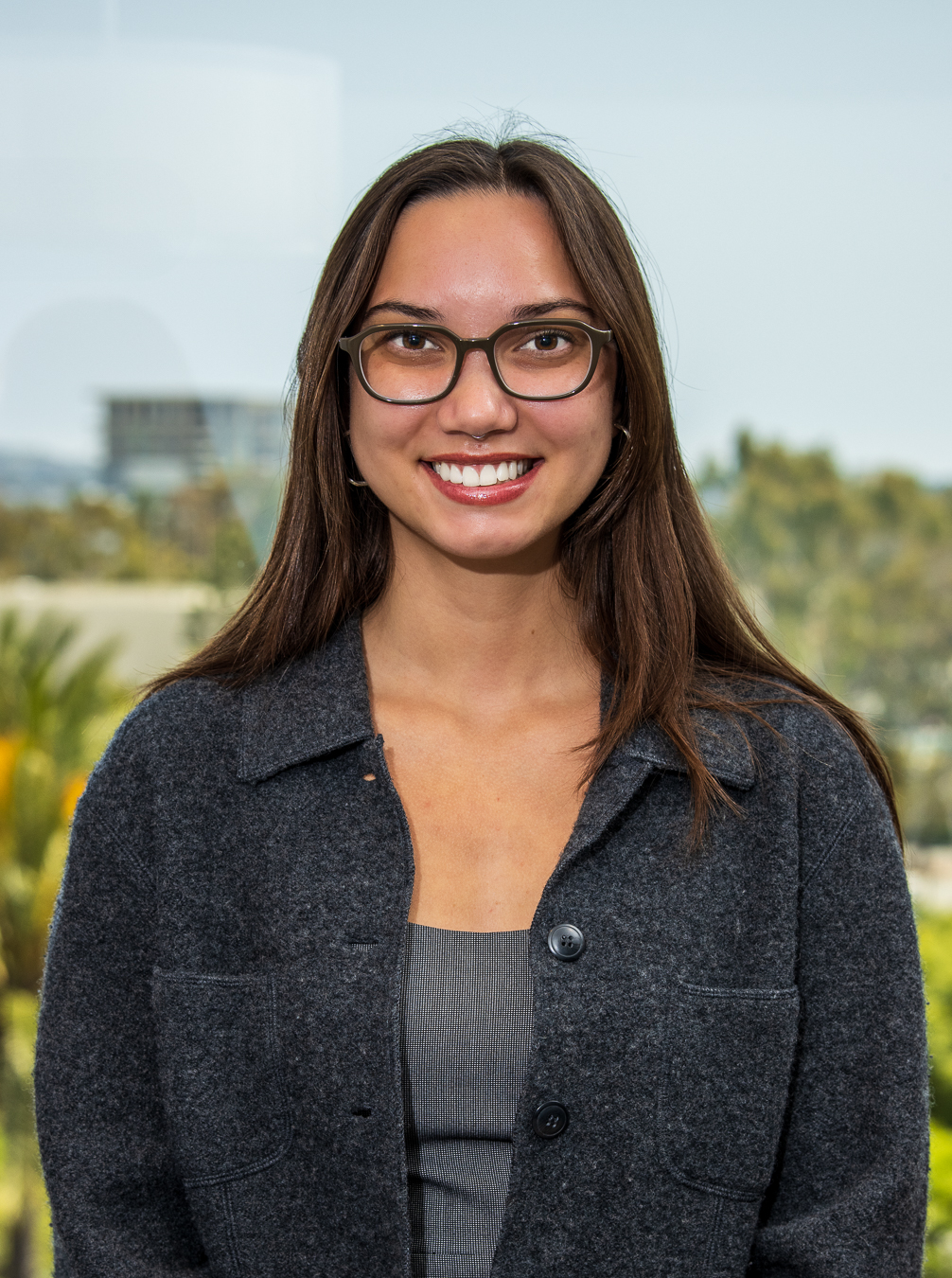 Smiling woman with glasses in office setting