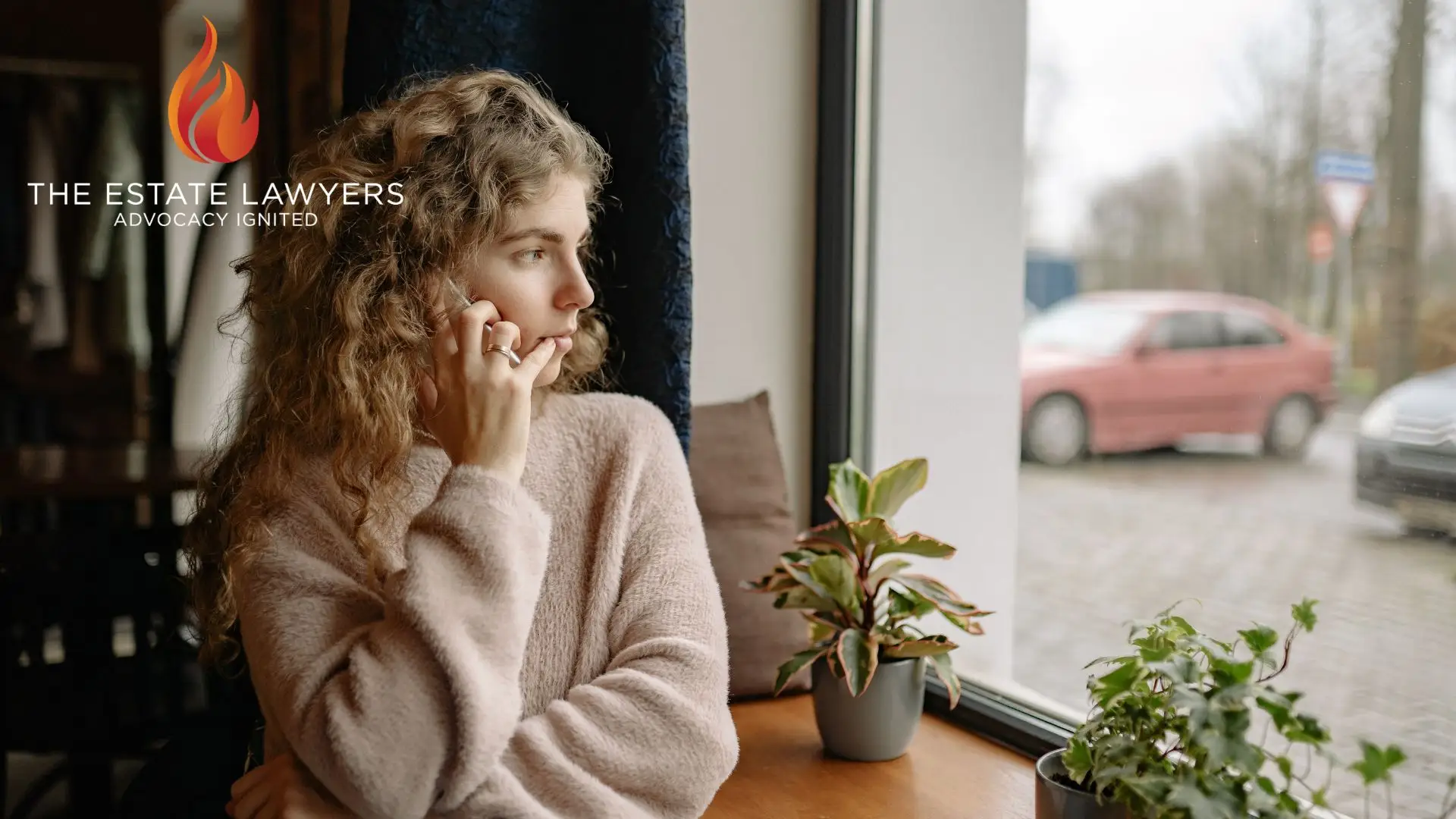 Woman on phone by window, plants on table