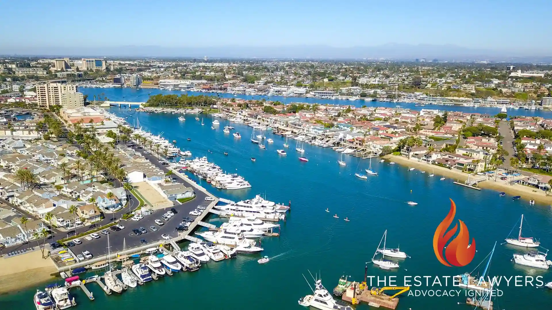aerial shot of a summer landscape at Newport Beach Harbor with boats and yachts docked on the green ocean water, where a growing population needs probate and trust services.