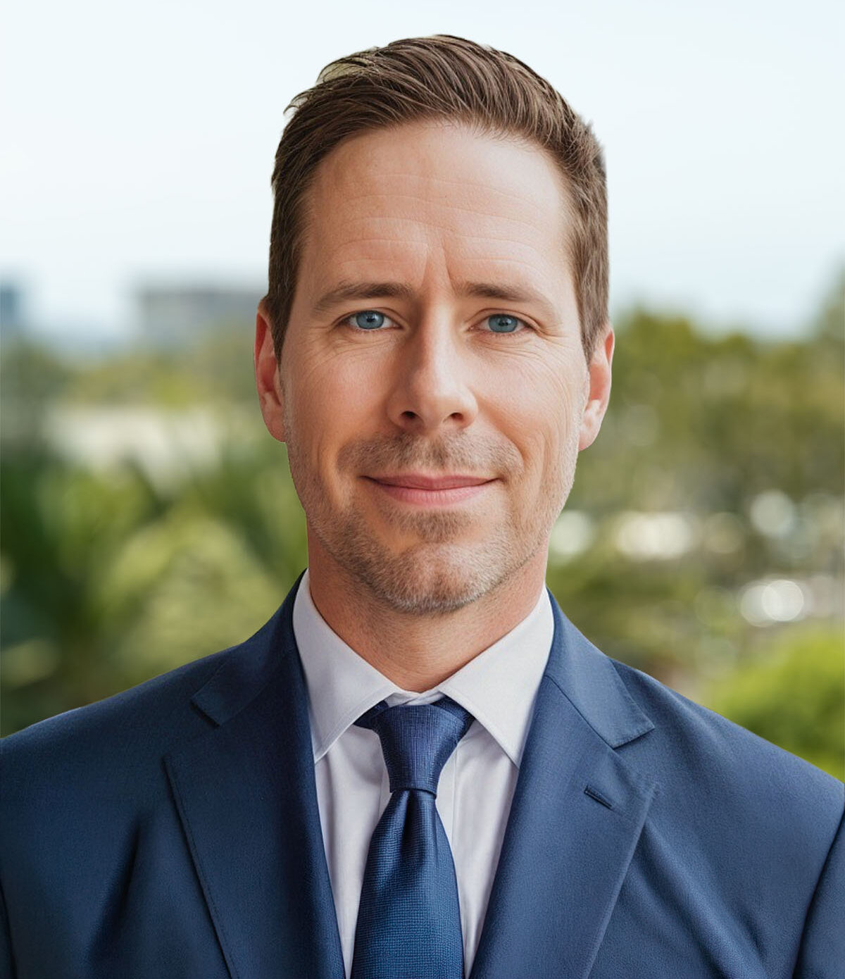 Professional man in navy suit and tie outdoors